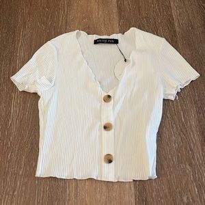 White fox. Size xs. White. Buttons on front. Never worn. Tags on.